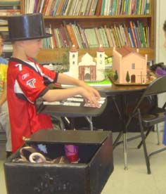 Kid learning magic trikcs Brandon Scott's Kids Magic School